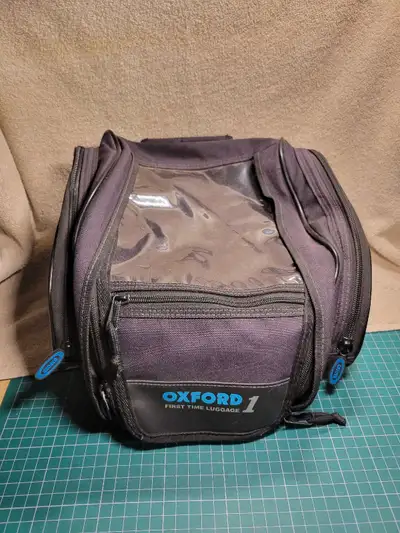 This tank bag has all the straps and bungee cords. Also has shoulder carrying strap like new inside...