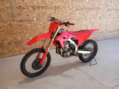 The bike looks and runs great. Fires up right away and battery holds charge. New front tire and good...