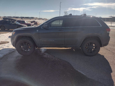 2014 jeep grand Cherokee lifted 33'" tires $13000