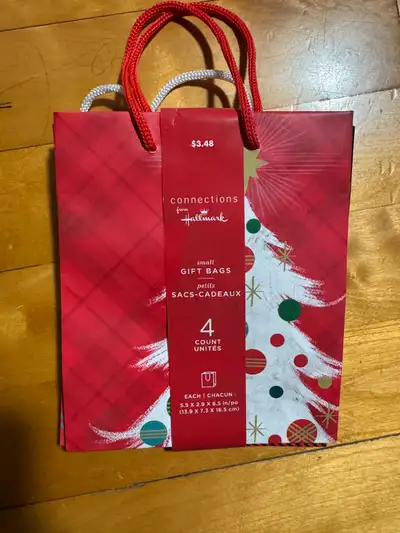 4 small Christmas gift bags, View more