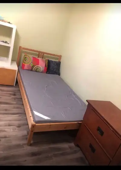 Spacious, bright, fully furnished room in the basement with a comfortable bed, closet, high-speed Wi...