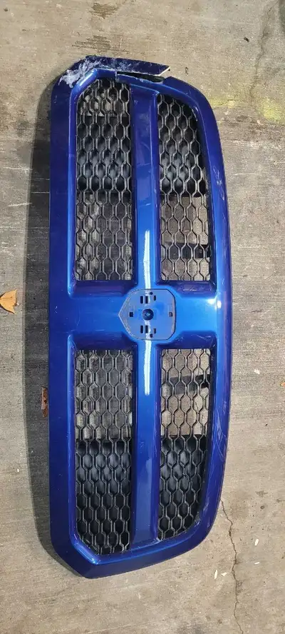 Ram 1500 or classic grill. Damaged on the one side, shown in pics but all there. Incerts and backing...