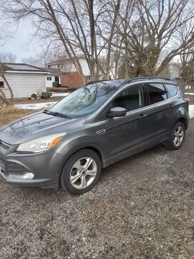 I'm selling a 2014 Ford Escape, a compact SUV known for its fuel efficiency and comfortable ride. Th...