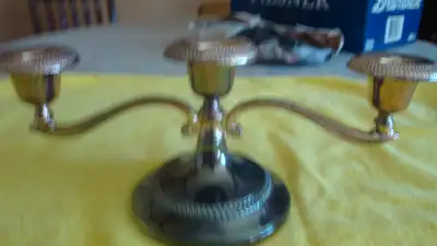Three armed candleabra. Silverplate. Measures 12 inches across. Holds 3 candles. See my other listin...