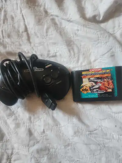 Une manette Et jeux genesis Texter télépner 438 406 6380