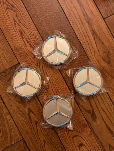 Set of brand new Mercedes-Benz hub/center caps. 75 millimeter in diameter, used in newer post 2010 m...