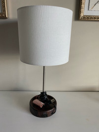 Lamp with outlet in base