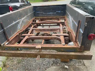 Utility trailer converted from an older one ton truck. Strong chassis and frame, needs new bedding a...