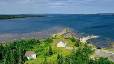 23-25 Tickle Lane, Main Brook, NL PropertyGuys com Sign # 94986 FOR FULL INFO: visit site and enter...