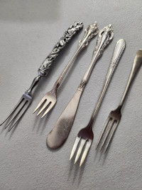 Small assorted olive forks and butter knife