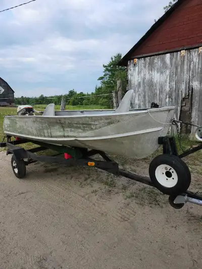 12' Aluminum fishing boat in good condition. Has a ding where a tree fell on it but it doesn't leak....