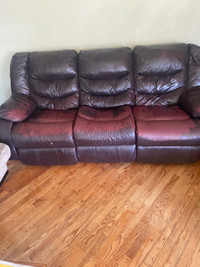 Sofa with 2 recliners. It has a little tear on left arm rest. 