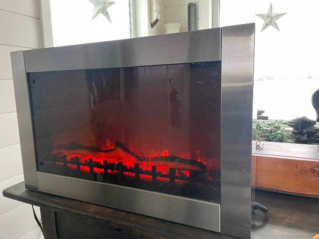 Electric Fireplace-works perfect-Produces good heat- barely used in Heaters, Humidifiers & Dehumidifiers in Red Deer