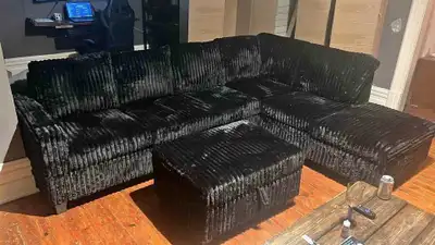 Black coloured large fabric sofa for sale , View more