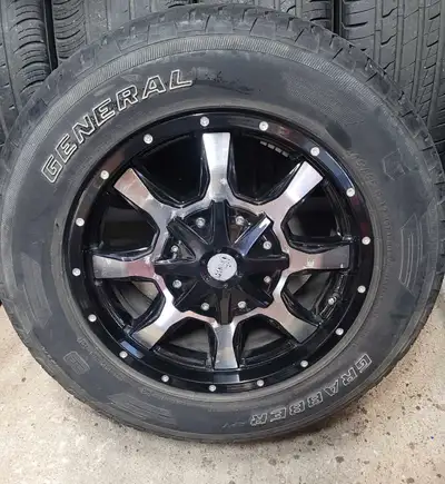 Selling a set of used General Grabber 245/65R17 tires mounted on rims, suitable for an Envoy or Trai...