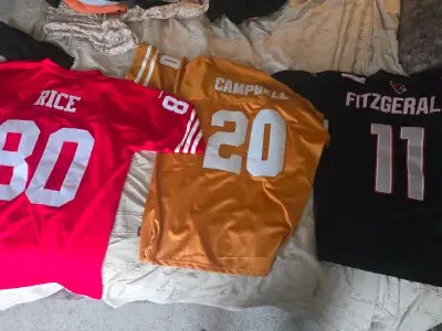 Selling slightly used football jerseys. Earl campbell texas longhorns Jerry rice san francisco 49ers...