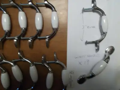 Cabinet Handles White& Chrome 3" centers X 19 REDUCED $20.00 OBO also I have Oil Rubbed Bronze Handl...