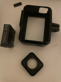 GoPro battery and replacement lens cover