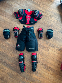 Youth Hockey pants, shoulder pads, shin/elbow pads and gloves.
