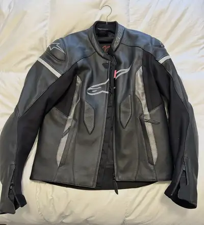 Alpinestars leather riding jacket (Size 42) in mint condition — barely worn, leather still stiff. Pa...