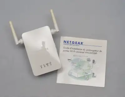Netgear WN3000RP Universal WiFi Range Extender, designed to boost existing wireless network coverage...