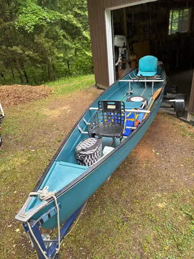 Coleman Scanoe, 16’. Trailer permits easy launching and highway towing. Very light, can be towed by...