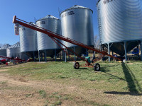 Seed treating auger