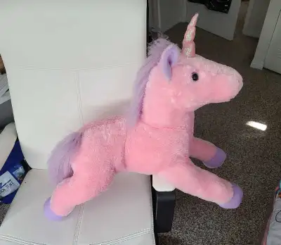 big stuffed unicorn toy.
