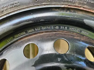 Four 16 inch steel rims with old winter tire still on, and a set of four 18 inch tires with less tha...
