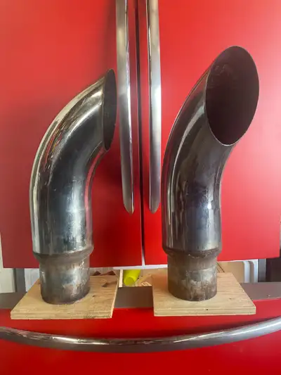 Two large chrome exhaust tips off a dump truck. Could be modified for a pick up truck. Good conditio...