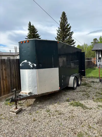 Custom built 16’ long x 6’3” high x 5’9” wide enclosed job trailer. Inside of trailer has, - Custom...