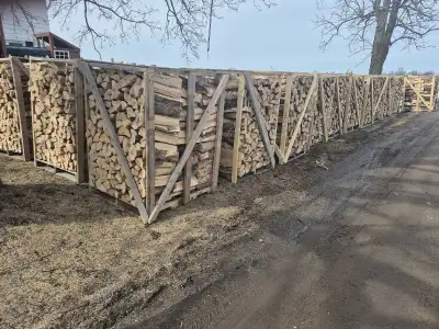 Seasoned mixed hardwood firewood FOR SALE Split and stacked 1 1/2 face cord per rack Small + large a...