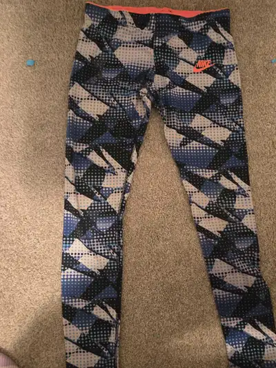 Soft Nike pants size MM. I'd say, fit is seven or eight year old