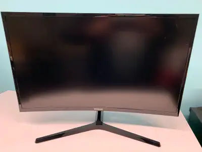Immerse yourself in vivid detail with this used Samsung 27-inch curved LED monitor, model C27F396FHN...