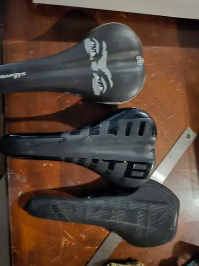 Selling a set of three used bicycle seats, perfect for various riding styles. These saddles have see...