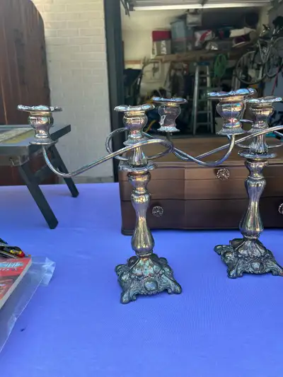Add a touch of vintage elegance to your dining experience with these used silver candelabras, perfec...