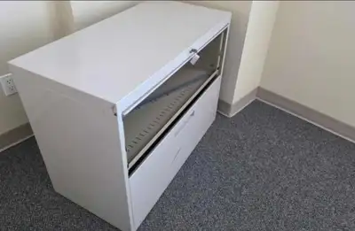 This white 2-drawer lateral filing cabinet is perfect for organizing your home office or workspace w...