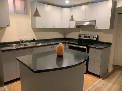 Location! Location! 2 Bedroom plus den Legal Basement