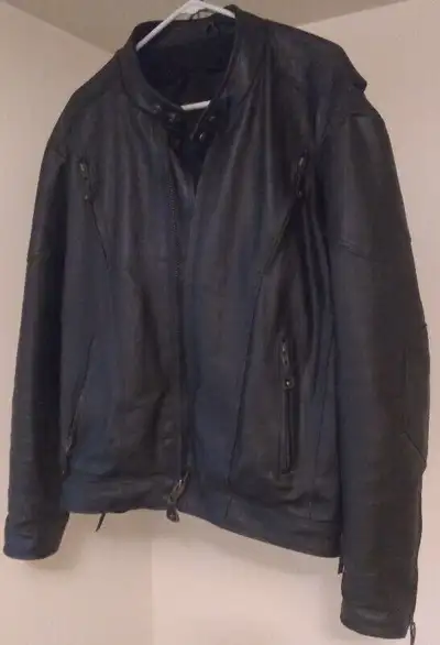 Man's black leather motorcycle jacket, very clean, steel zippered, protective pads, lace up sides fo...