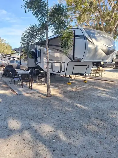 Spacious Fifth Wheel RV in great condition and low mileage. Features include full sized refrigerator...