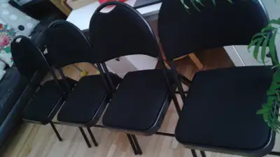 FOUR BLACK CHAIRS, View more