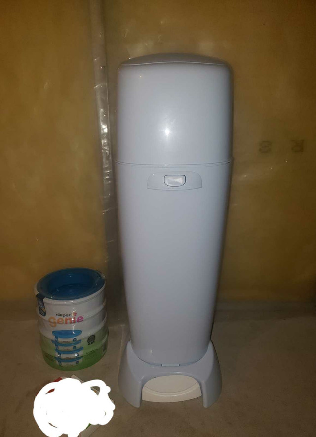 New condition diaper genie with 4 new refills /2 carbon filters  in Bathing & Changing in Calgary