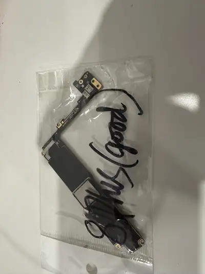 This is a used iPhone motherboard that's still in good working condition. It comes from a working iP...