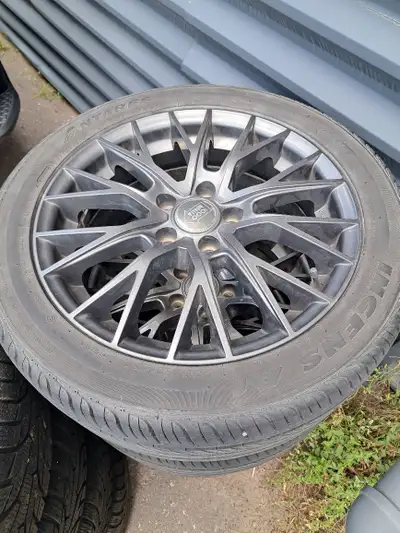 Winter Tires on VW rims, about 50% left. 55mm hubs, 5 bolt pattern. Summer Tires on Miele Rims. $200...