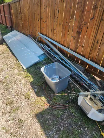 I have a good condition all parts included garage door 16 ft wide by 9 ft tall oversized. Must pick...