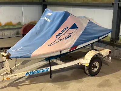 1994 650 Polaris Watercraft with Trailer. It runs roughly but probably needs a tune up. The trailer...