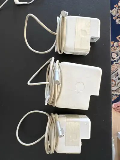 $20 each One is an original MagSafe 85w, working, slightly torn Two are original MagSafe 45w with re...