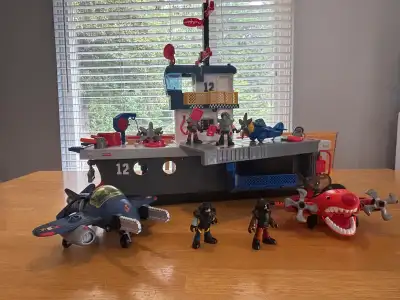 FisherPrice Imaginext Aircraft Carrier and Sky Racer planes Comes with 4 planes and 4 guys.