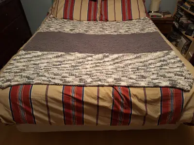 This blanket would make a beautiful wedding gift or baby shower gift. It is made from blanket yarn t...