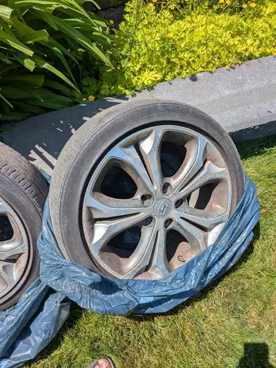 Used Hyundai tires and rims size p215/45R17 ready to be picked up.